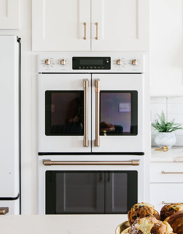 White Kitchen Cabinets With Black Matte Appliances With Rose - A ...