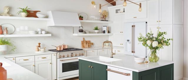 white matte kitchen with brushed bronze, stainless steel, and copper