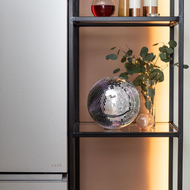 Disco ball on shelf by Modern Glass refrigerator