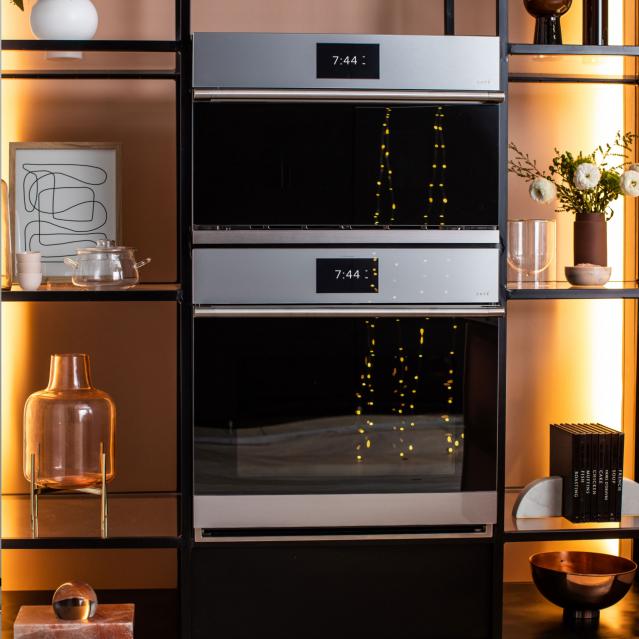 Twinkle lights reflected in wall ovens