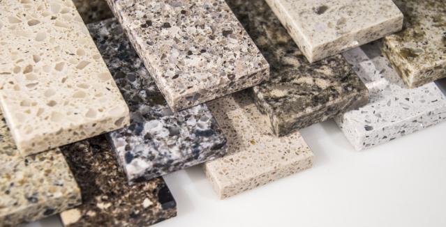 A stack of samples of various types of countertops